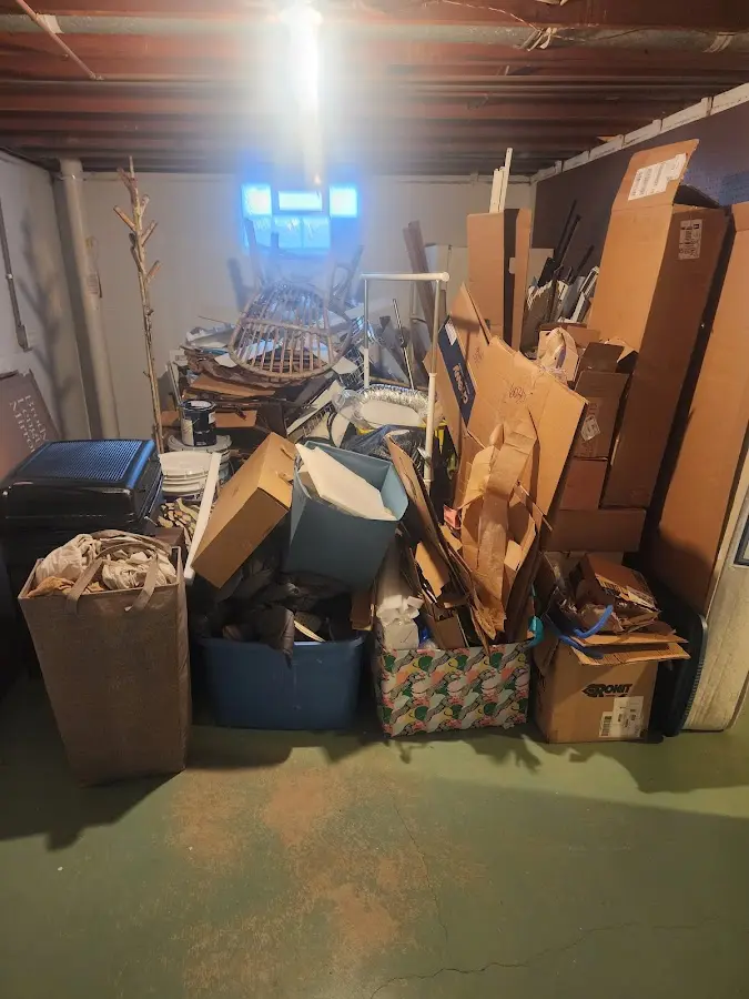 Roll-off dumpster container at job site for 2 Yard Dumpster Rental in Alvin